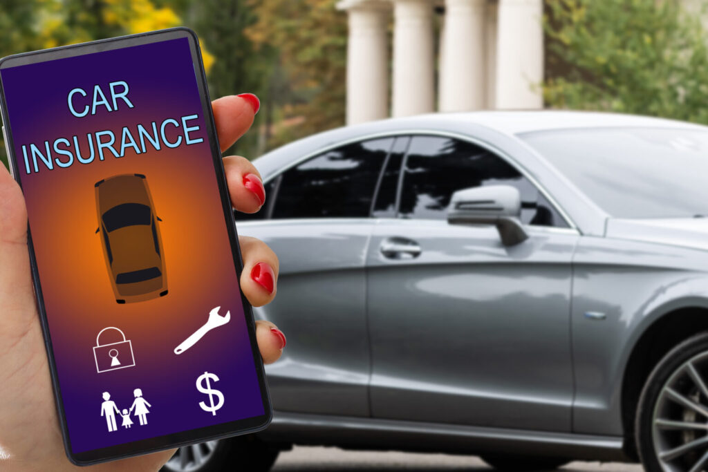 woman hand holding smartphone to use car insurance application online after his broken car. Insurance concept.